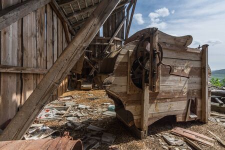 Old wooden thresher in an attic of an abandoned houseのeditorial素材