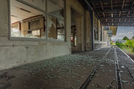 many shards of a window of a factory with railsのeditorial素材