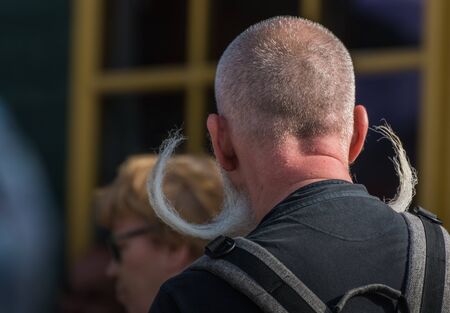 man with twisted long beard at a country eventのeditorial素材