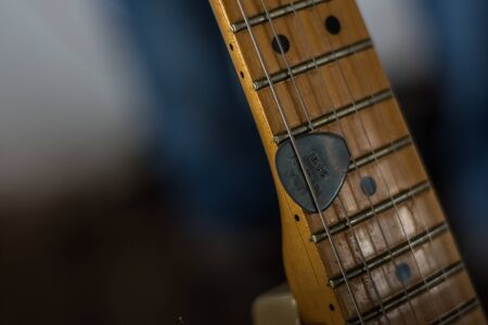 guitar with a pick detailed view at a concertの写真素材