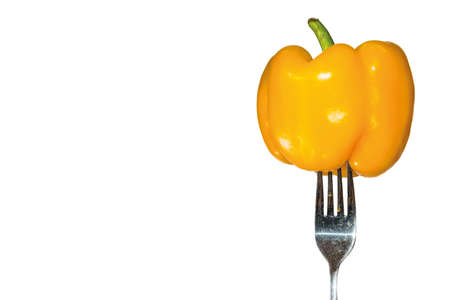 peppers on a fork with white backgroundの写真素材