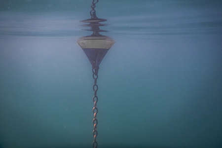 buoy under the water surface while diving in a lake