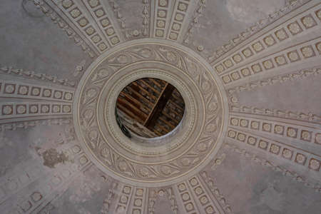 decorated dome with hole from a old castleの写真素材