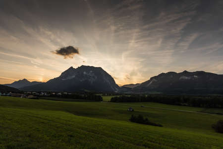 mountain landscape with clouds while sunset in the summer