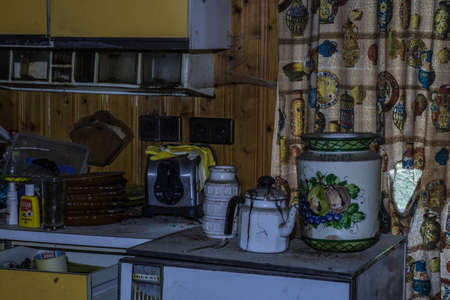 kitchen with old objects in a abandoned houseの写真素材
