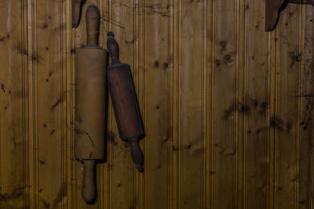zwo pastry roller on a wooden wall in a old house