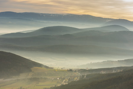 dense ground fog and mountain landscape while hiking in the spring