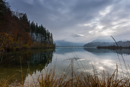 beautiful lake with colorful trees in autumn on vacation