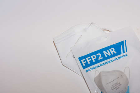white FFP2 or KN95 mask with wrapping on white background