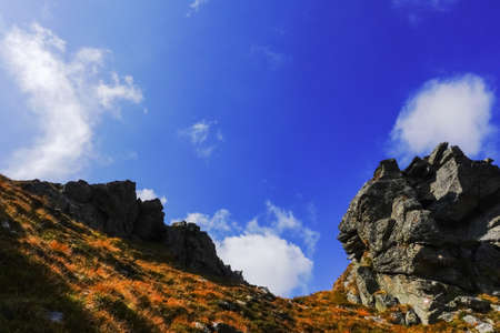 deep blue sky with soft clouds in a colorful mountain landscape in austria