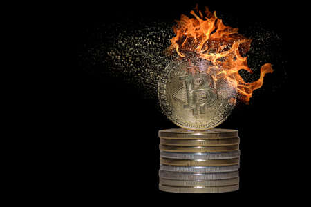 stack of many valueable burning decomposes and dissolves bitcoin from crypto currency with black backgroundの写真素材