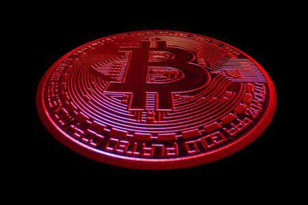 red single bitcoin distored view from crypto currency during falling market on black backgroundの写真素材