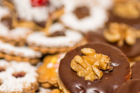 very tasty christmas cookies with chocolate and nuts detail view