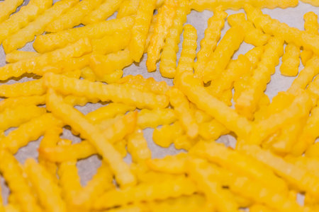 golden crispy and tasty french fries detail view
