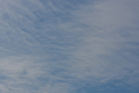 soft little clouds at the blue sky after storm in the springの写真素材