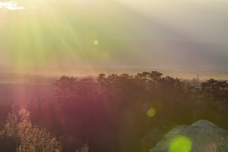 colorful shining sun in a landscape during hiking in the springの写真素材