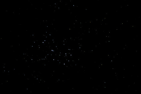 lot of colorful stars at the dark black sky in the winterの写真素材