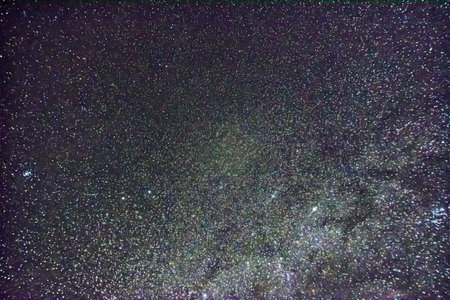 millions of stars at a black sky in the night and winterの写真素材