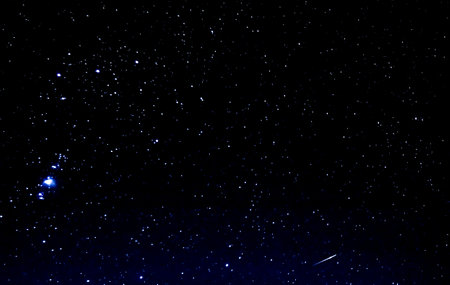 millions of bright stars at a dark black night in the winterの写真素材