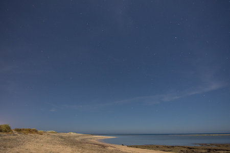warm beautiful night at the beach and red sea during vacation in egyptの写真素材