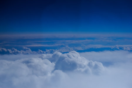amazing white clouds over a blue sky during a flight on summer vacation
