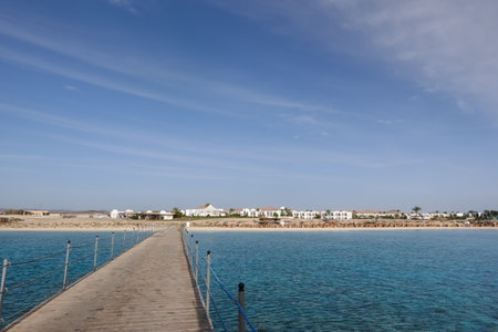 long jetty to the buildings from a resort on vacation in egypt at the sea with blue skyの写真素材