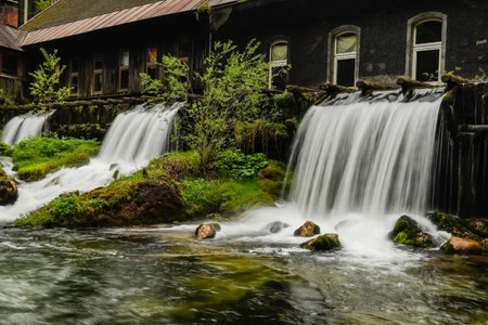 amazing waterfalls near a old abandoned factory detail viewのeditorial素材