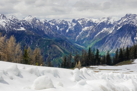colorful mountain range with lot of snow in the spring