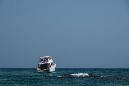 white boat with strong waves at a trip