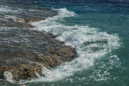 waves at the coral reef during a storm in egyptの写真素材