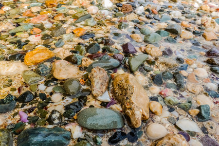 lot of colorful stones at the beach in egypt on vacationの写真素材