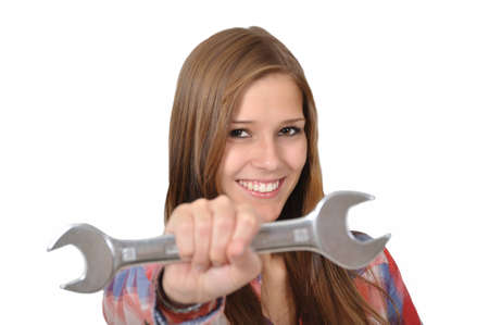 dynamic attractive artisan holds a wrench into the cameraの写真素材