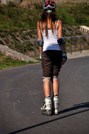 The back of a young skatergirlの写真素材