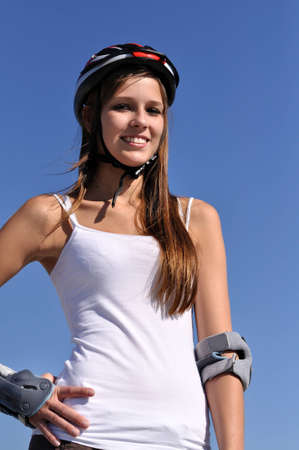 Woman does sport under blue sky