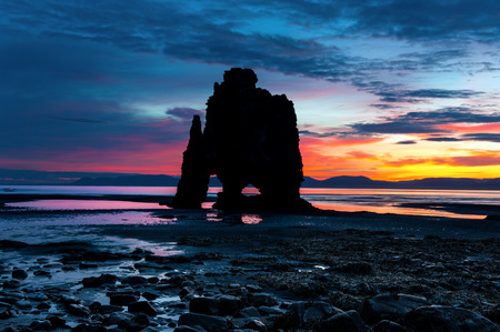 Silhouette of Hvitserkur at sunrise. A 15 m. high basalt stack situated in Vatnsnes peninsula, in the northwest of Icelandの写真素材