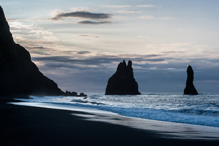 Reynisdrangar. Basalt seastacks situated under the mountain Reynisfjall near the village Vik i Myrdal, southern Iceland.の写真素材