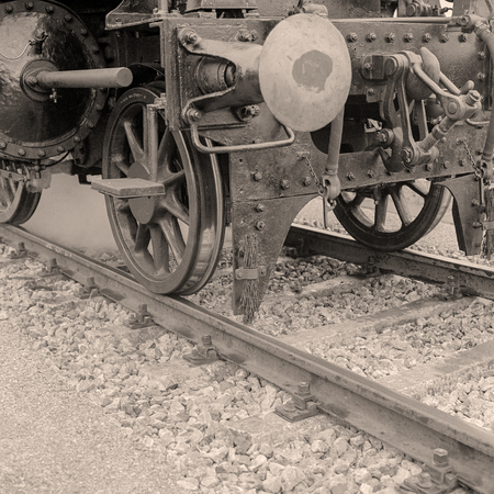 Detail of an old-fashioned steam locomotive in an austrian railway station. Scan from a 6x6 B&W...