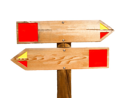 Wooden signs show in the opposite direction. Picture taken near Querenca in the Algarve in southern Portugal.の写真素材