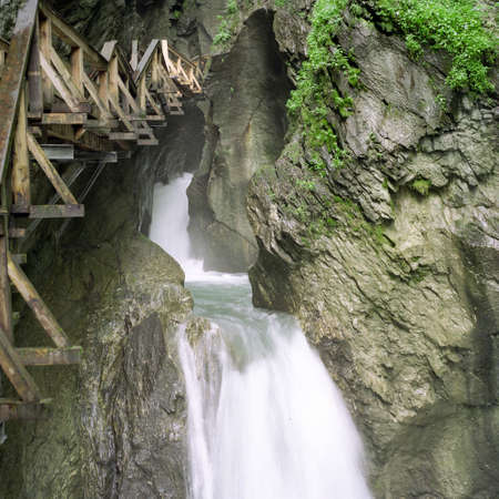 Waterfall with wooden walkway in the Tscheppaschlucht in Carinthia in Austria. Old view back from 1999. Scan from a 6x6 negative.の写真素材