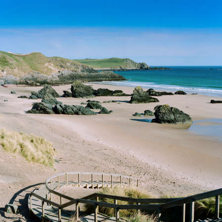 Sandy beach in Durness in Scotland with a blue sky. Picture taken in april 1999. Scan from a 6x6 negative.の写真素材