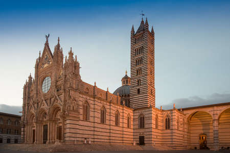 Siena Cathedral in the last sunset lightの写真素材