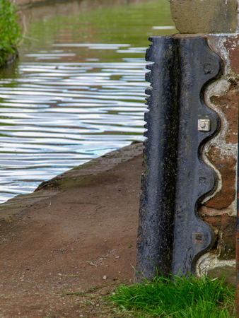 Tow rope marks on an iron rubbing strip on a bridge over the Shropshire Union Canal in Market Drayton, Englandの写真素材