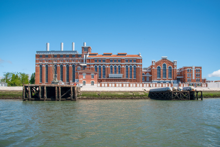 The Tejo Power Station was a thermoelectric power plant. After shut down in 1975 it opend its doors in 1990 as an Electricity Museum. View from a boat on the Tagus River.のeditorial素材