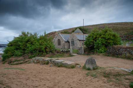 Parish Church of St Winwaloe named also the Church of the Stormes  in Gunwalloe, Cornwallの写真素材