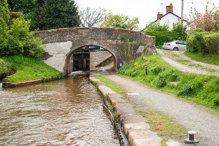Grindley Brook Bridge No 28 with an adjoining canal lock.の写真素材