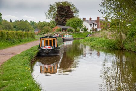 Scenic canal view with mooring narrowboats on the Llangollen Canal near Whitchurch, Shropshire, UKの写真素材