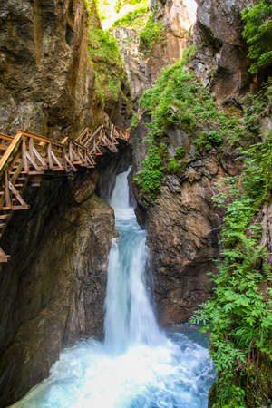 Walking through the Sigmund-Thun Klamm with wooden walkways near Kaprun in Salzburg, Austria