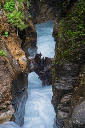 Walking through the Sigmund-Thun Klamm with wooden walkways near Kaprun in Salzburg, Austriaの写真素材