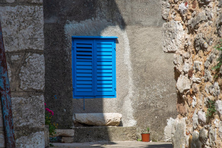 Blue window in Dobrinj. Dobrinj is a small town located on Krk island, dating back to medieval times.の写真素材