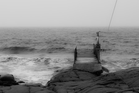 A picture of a small bathing pier in an atmospheric setting の写真素材